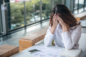 employee is stressed about asking her company on taking a FMLA leave