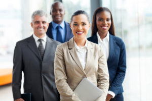 hr consultants that assist companies to be in compliance with many laws pose for picture