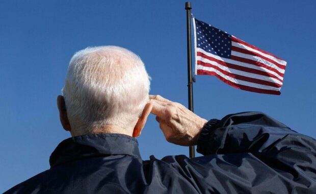 view of a veteran saluting the flag of the united states