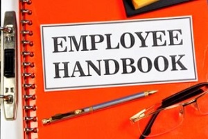 employee handbook on clipboard