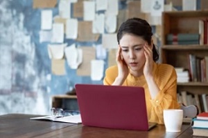 asian women suffering from work anxiety