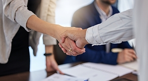 HR support shaking hands with business owner