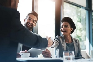 man shaking hand with hr executive