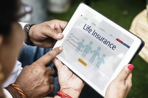 people checking life insurance on tablet