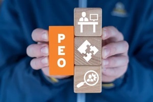 man holding colorful blocks sees abbreviation PEO servics